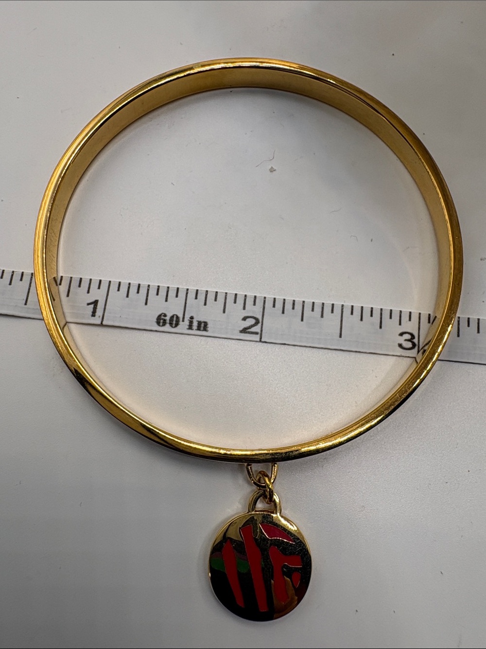 Gold-Tone Bangle Bracelet with Red and Green Enamel Disc Charm